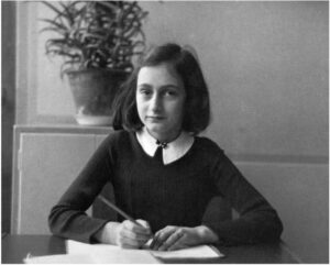 Anne Frank at her desk in school photo