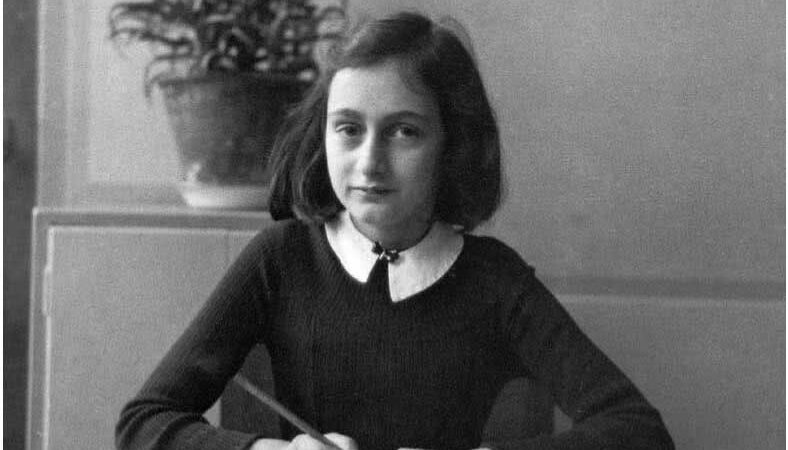 Anne Frank at her desk in school photo
