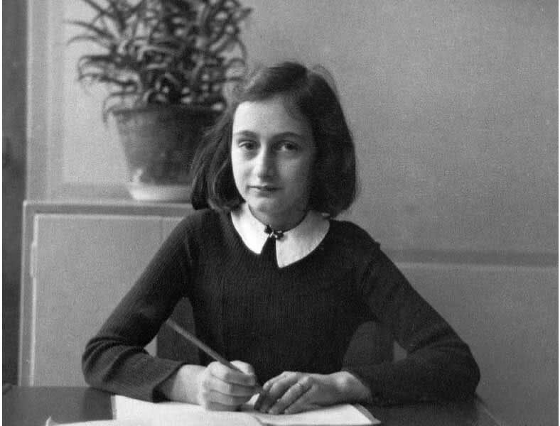 Anne Frank at her desk in school photo